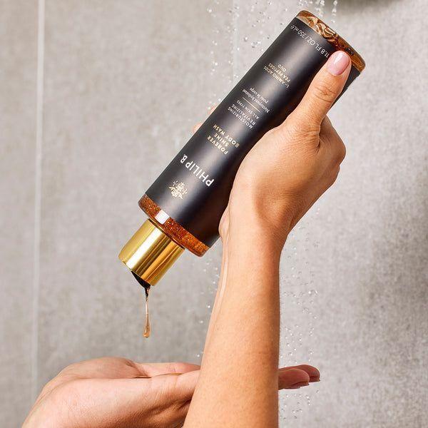 Philip B. Forever Shine Body Wash in 11.8 oz bottle, featuring a sleek container with a clear label and blue cap.