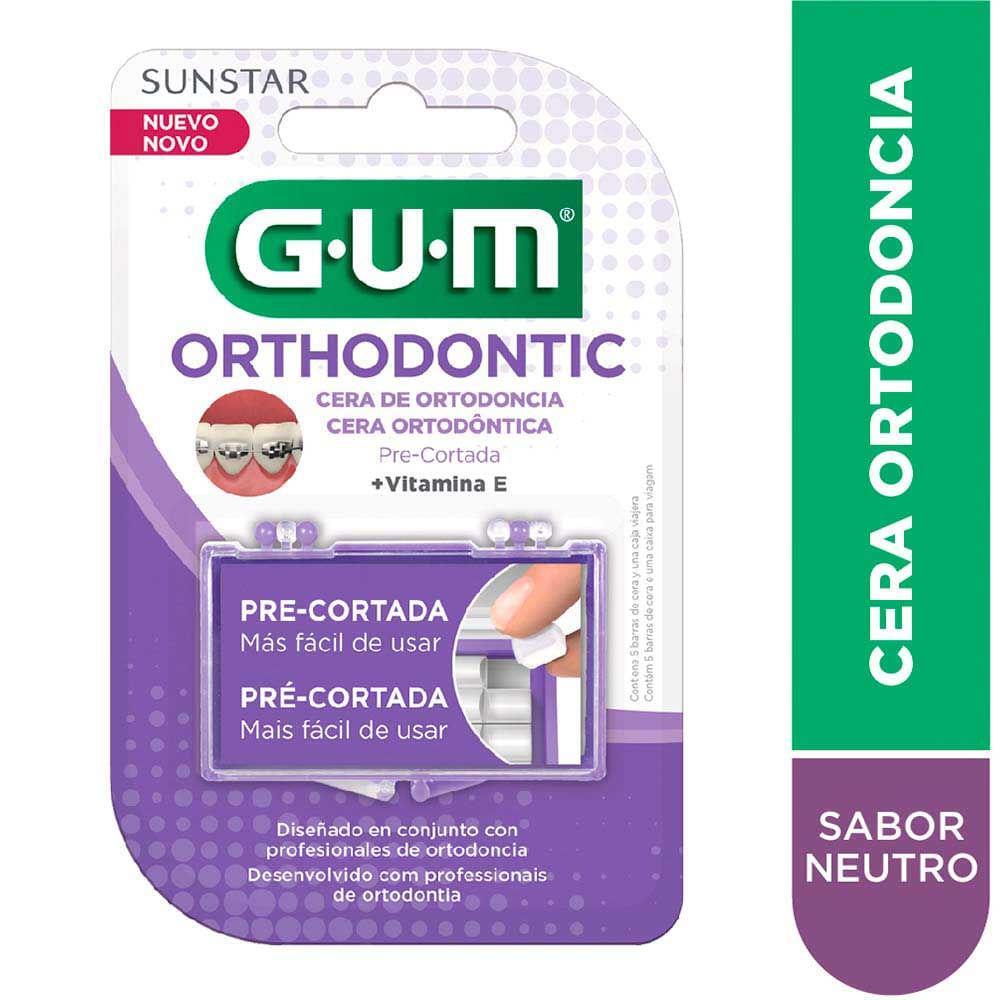 GUM Ortho Orthodontic Wax for braces, shown next to assorted candies and chocolates on a white background.
