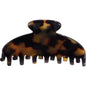 Yellow-brown Janeke claw clip by Pasteur Pharmacy, stylish hair accessory with durable design and secure grip.