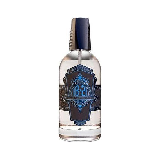 18.21 Man Made Absolute Mahogany men's cologne bottle, 3.4 fl oz, with a sleek design and dark mahogany-colored packaging