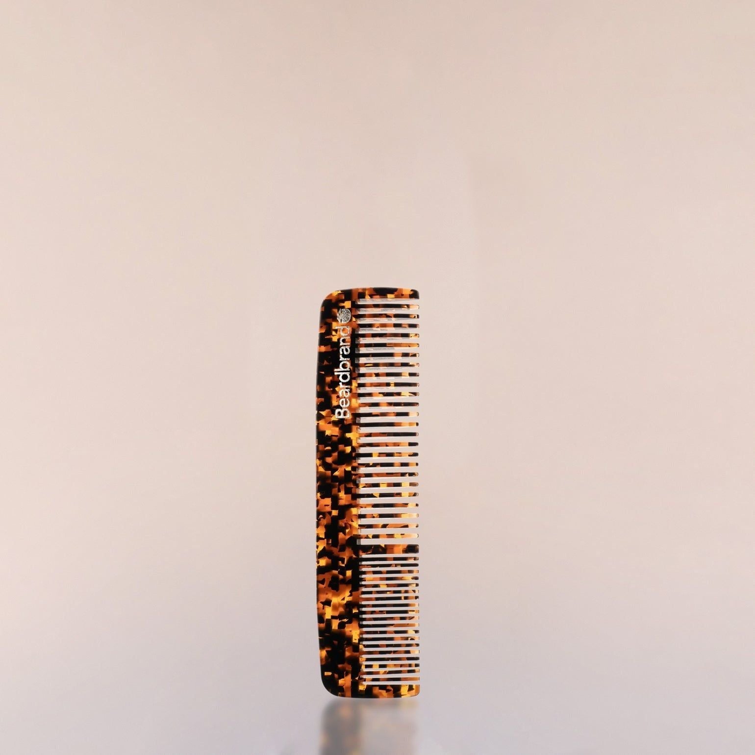Beardbrand Sand Storm pocket comb with wide and fine teeth for grooming facial hair, compact and portable for travel.