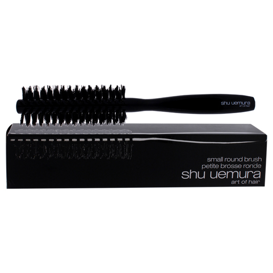 Small round brush by Shu Uemura for unisex, ideal for styling and blow-drying, shown with bristles and handle.
