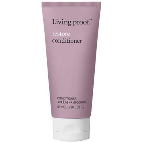Living Proof Restore Conditioner travel size 2 oz in a white bottle, suitable for hair repair and conditioning.