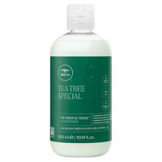 Paul Mitchell Tea Tree Special Tingle Conditioner 300ml bottle with green label and conditioner pour in hand.