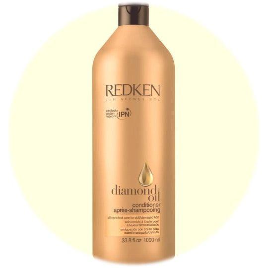 Redken Extreme Conditioner in a 33.8 fl oz bottle, visible label, with a focus on the conditioner’s packaging and branding.