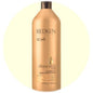Redken Extreme Conditioner in a 33.8 fl oz bottle, visible label, with a focus on the conditioner’s packaging and branding.
