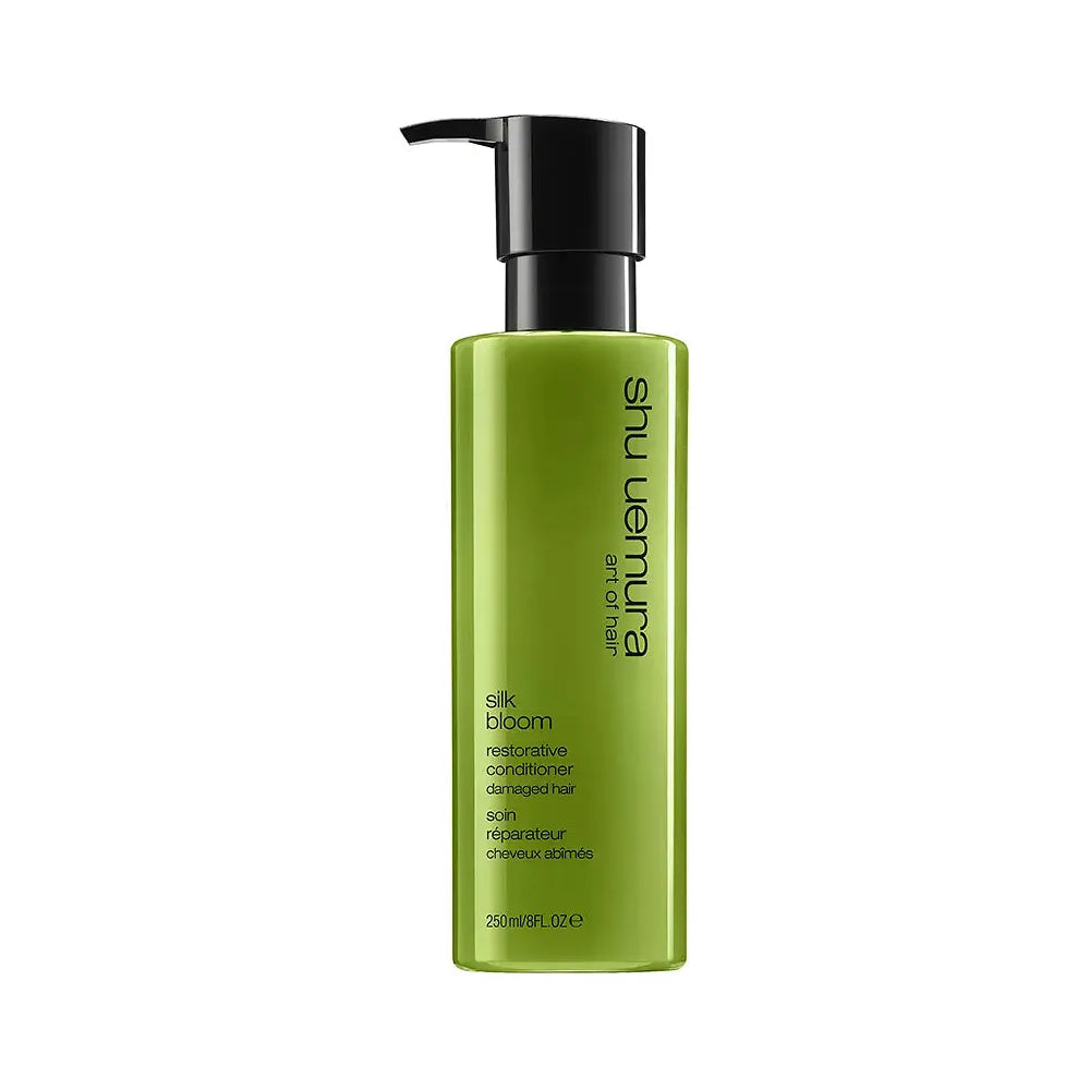 Shu Uemura Silk Bloom Restorative Conditioner bottle in 250ml size, with sleek packaging and product label visible.