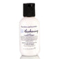 Bumble and Bumble Thickening Volume Conditioner in a white bottle with blue accents, designed to add fullness to hair.