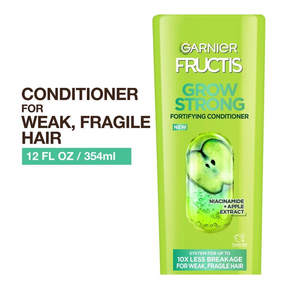 Garnier Fructis Grow Strong Conditioner for stronger, healthier, shinier hair, shown in a bottle with green and white packaging.