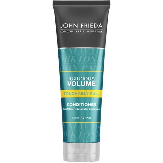 John Frieda Luxurious Volume Touchably Full Conditioner for fine hair, smooth and adds fullness to hair, in a white bottle with blue accents.