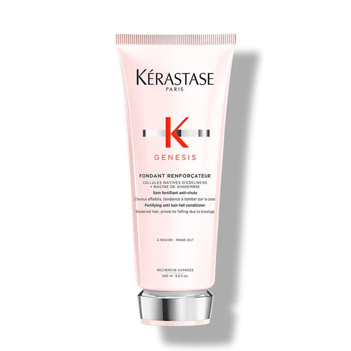 Kerastase Genesis Fondant Reinforcateur conditioner in a white tube with a gold cap, designed for strengthening hair.