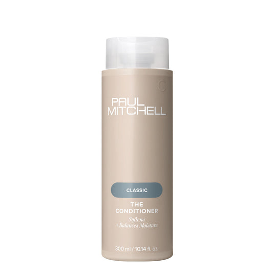 Paul Mitchell Classic The Conditioner 10.14 oz bottle, creamy conditioner for soft, smooth hair, shown in a natural setting.