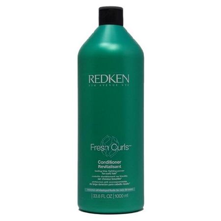 Redken Fresh Curls Conditioner for curly hair in a 33.8 fl oz bottle, featuring a lightweight formula for defined, bouncy curls.