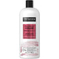 TRESemme Color Revitalize Conditioner for color-treated hair in a 28 Fl Oz bottle, designed to preserve vibrant hair color.