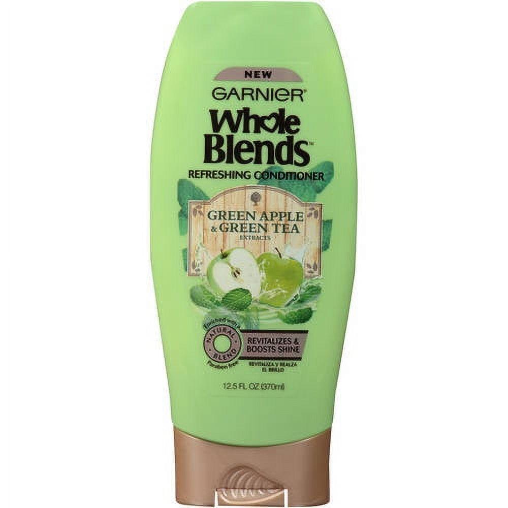 Garnier Whole Blends Green Apple Conditioner in a 12.5 fl oz bottle, nourishing hair with natural green apple extract.