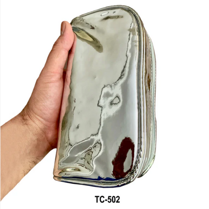 Silver metal Kingsley travel cosmetic and toiletry organizer bag by Pasteur Pharmacy, with multiple compartments for makeup and toiletries.