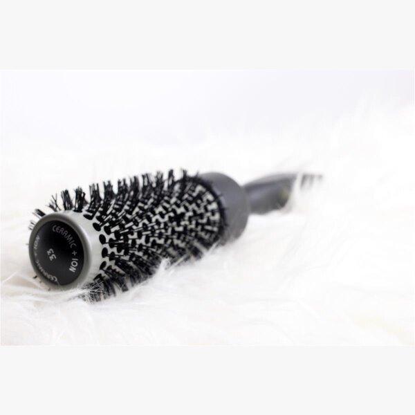 Keller Spiral Curler 25mm from Pasteur Pharmacy, showing the black curling iron with spiral barrel for creating curls.
