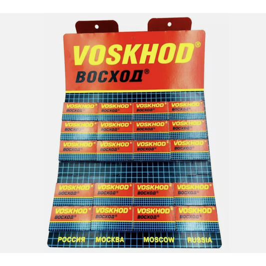 Voskhod Teflon-coated double edge blades, 20 packs of 5, shown in a blister pack with sharp blades visible for safety and precision shaving.