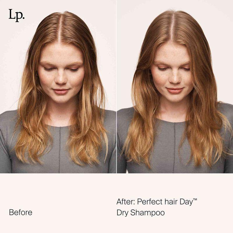 Living Proof Perfect Hair Day Dry Shampoo 5.5 oz bottle showing the product label and spray nozzle.