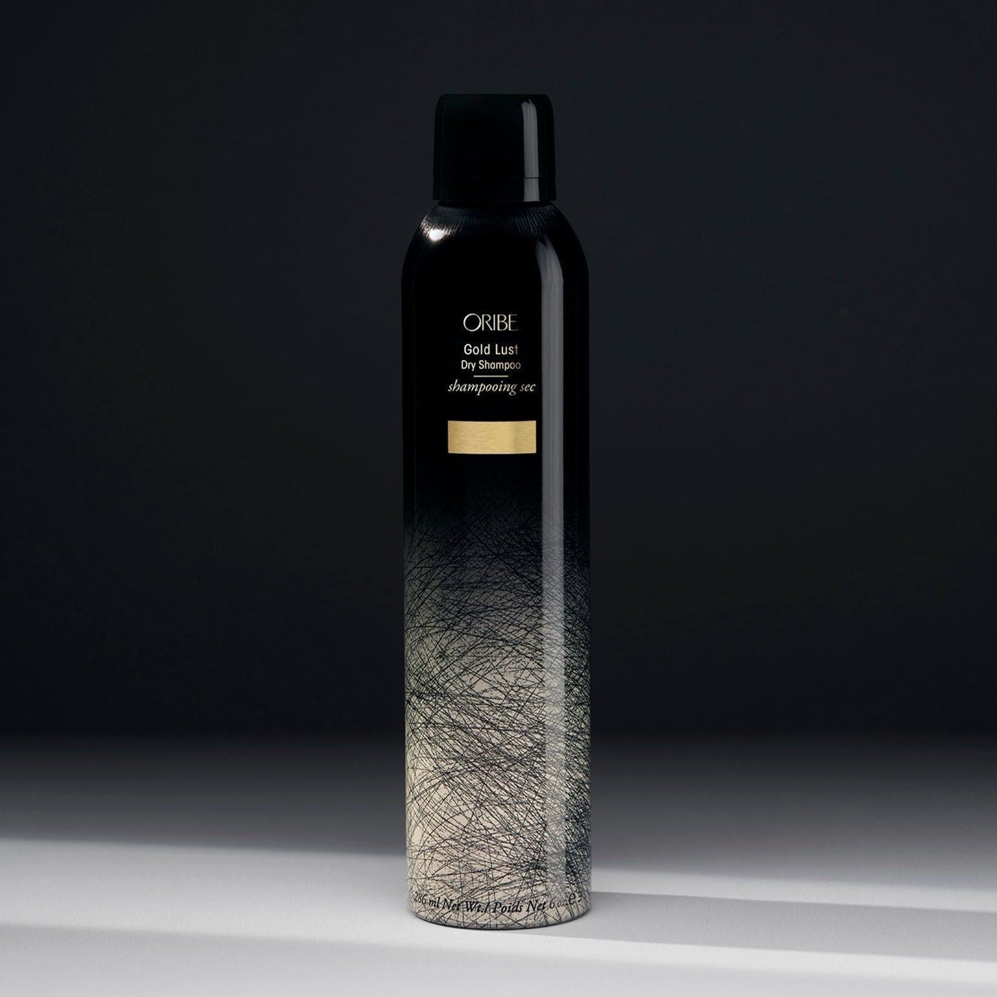 Oribe Gold Lust Dry Shampoo 300ml bottle with sleek packaging, designed for refreshing hair between washes.