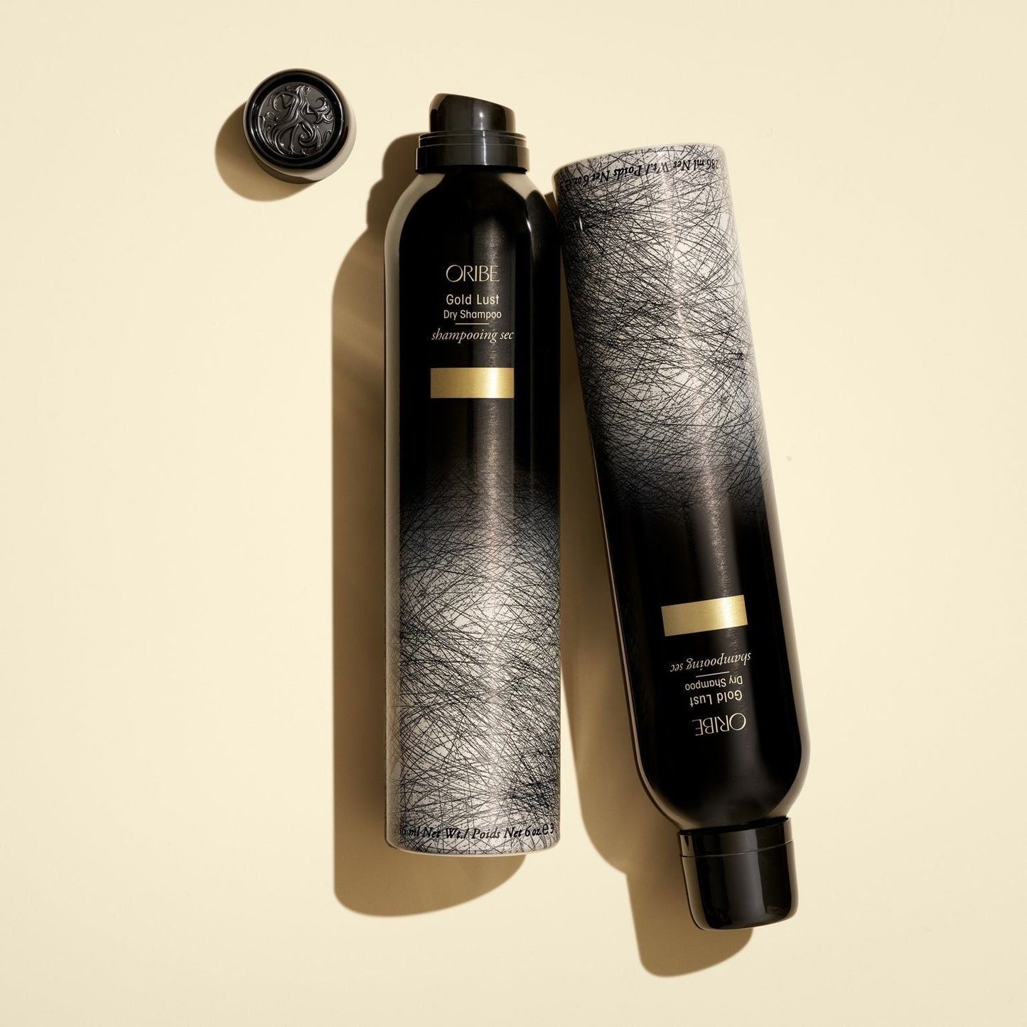 Oribe Gold Lust Dry Shampoo 300ml bottle with gold accents, designed for refreshing and revitalizing hair.