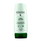 Kerastase Resistance Ciment Anti-Usure treatment bottle for damaged hair lengths, 200ml, on a wooden end table.