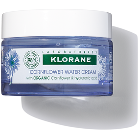 Klorane Cornflower Water Face Cream 50ml in a white jar, gentle skincare product for soothing and hydrating skin.