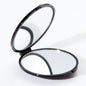 Pasteur Pharmacy M582 travel face mirror with 7X magnification and normal view, compact for easy portability.