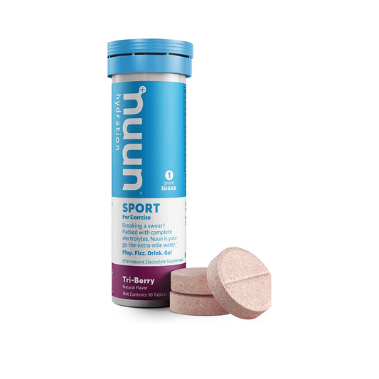 Nuun Sport Tri-Berry flavored electrolyte drink tablets in a transparent container, designed for hydration and fitness nutrition.