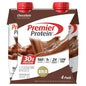 Four Premier Protein high protein shakes in chocolate flavor, in sleek bottles, for fitness and nutrition.