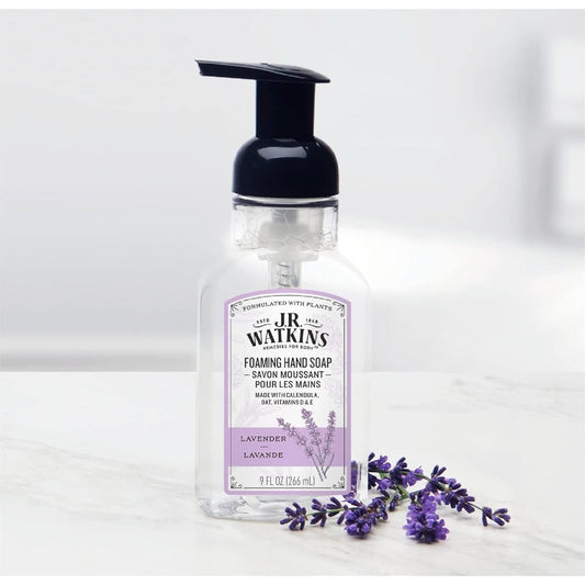 J.R. Watkins Lavender Foaming Hand Soap 9 oz bottle with lavender scent and pump dispenser, displayed on a bathroom counter.