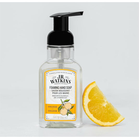 J.R. Watkins orange foaming hand soap in a 9 oz pump bottle, featuring bright orange liquid and a clear label with brand and product details.