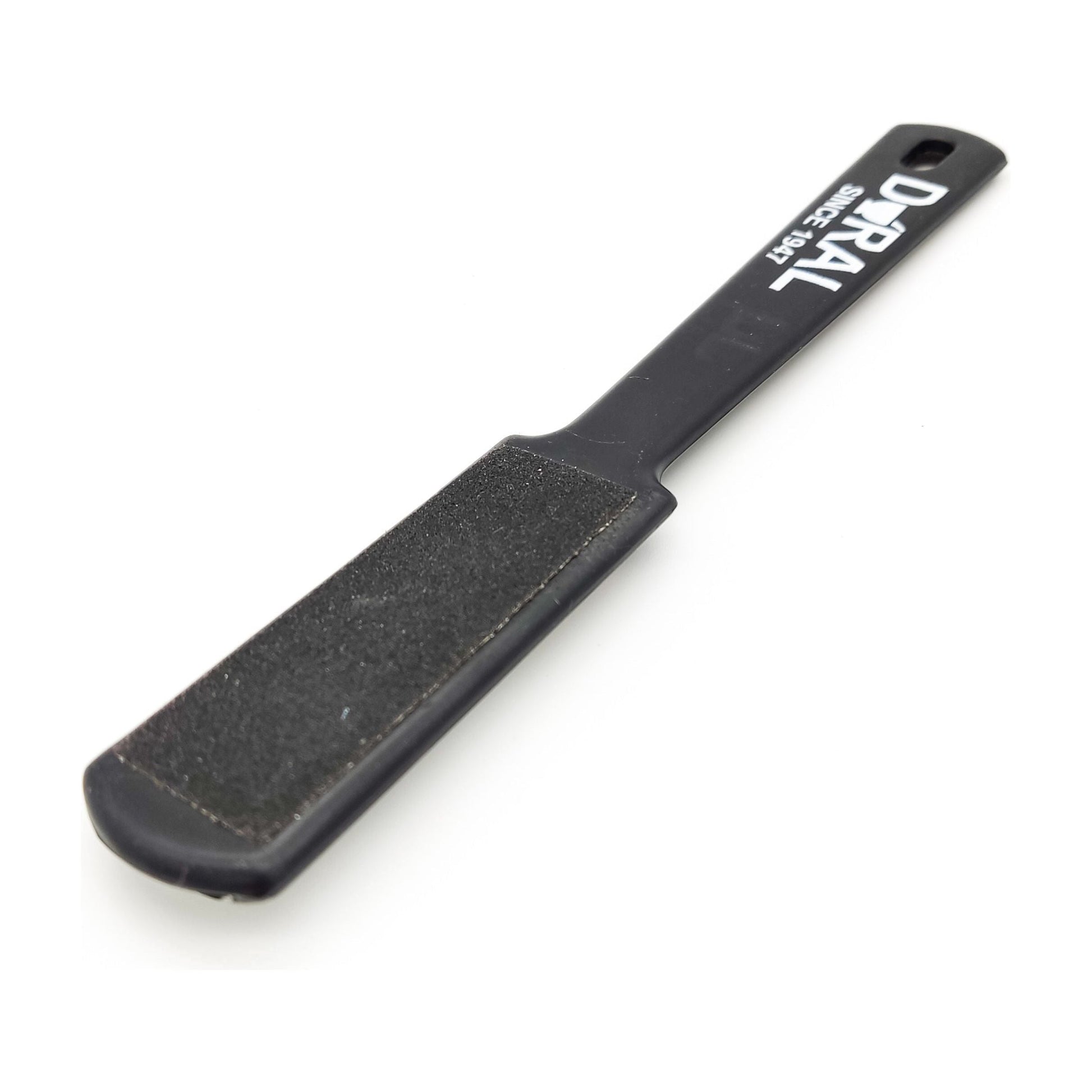 Black Dural Foot Rasp for foot care by Pasteur Pharmacy, featuring a textured surface for exfoliating and smoothing feet.