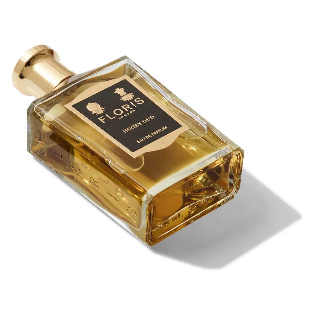 Floris London Honey Oud Eau De Parfum 100ml fragrance bottle with gold accents, showcasing elegant packaging and luxurious scent.