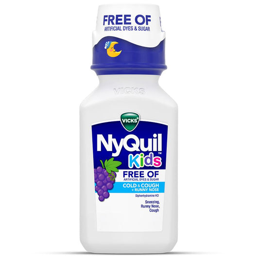 Bottle of Vicks NyQuil Kids Nighttime Honey flavor syrup in front of grapes, highlighting artificial-free formula and kid-friendly packaging.