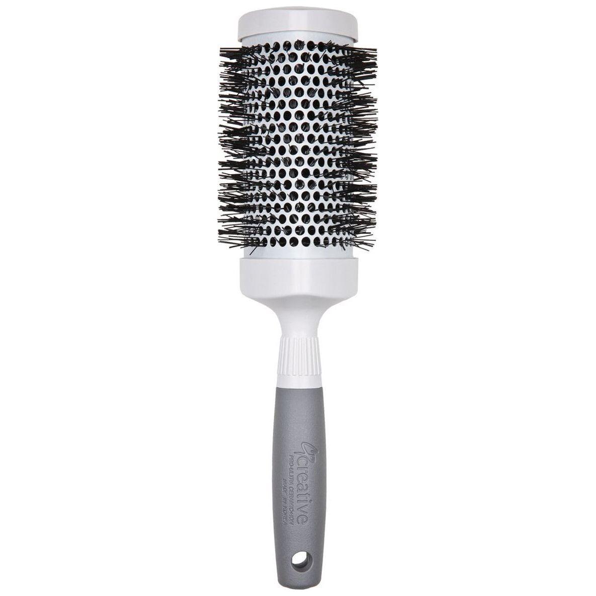 Pro Ceramic Triangle Hair Brush by Pasteur Pharmacy, featuring a sleek ceramic design and ergonomic handle for styling.