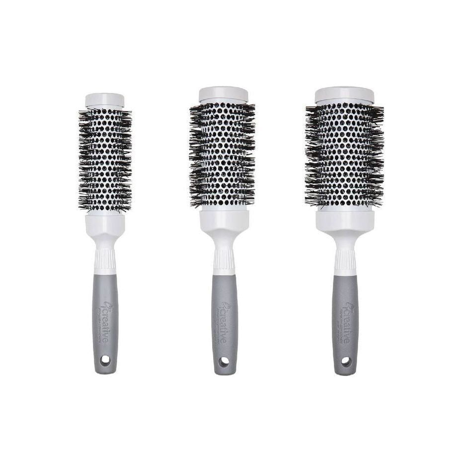 Pro Ceramic Triangle Hair Brush by Pasteur Pharmacy, with a sleek ceramic design for smooth styling and detangling.