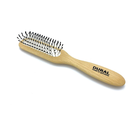 Dural hair brush by Pasteur Pharmacy with rubber cushion, steel pins with ball tips, and beech wood handle for styling and care.