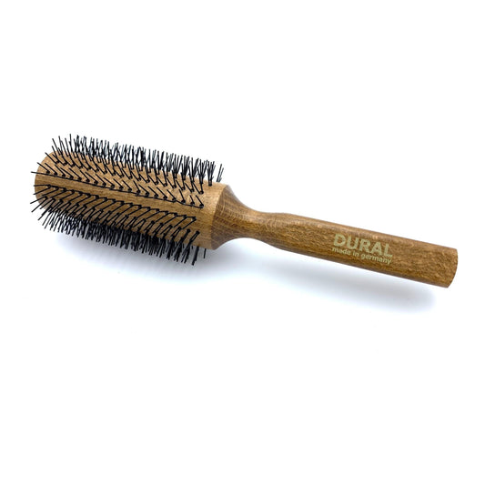 Dural hair styling brush with nylon pins and beech wood handle, designed for gentle grooming and styling.