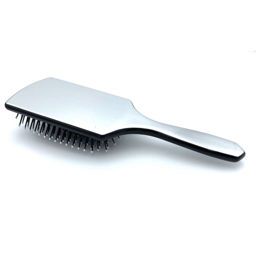 Dural paddle hair brush by Pasteur Pharmacy with plastic pins for styling and hair care, shown with wide rectangular surface.