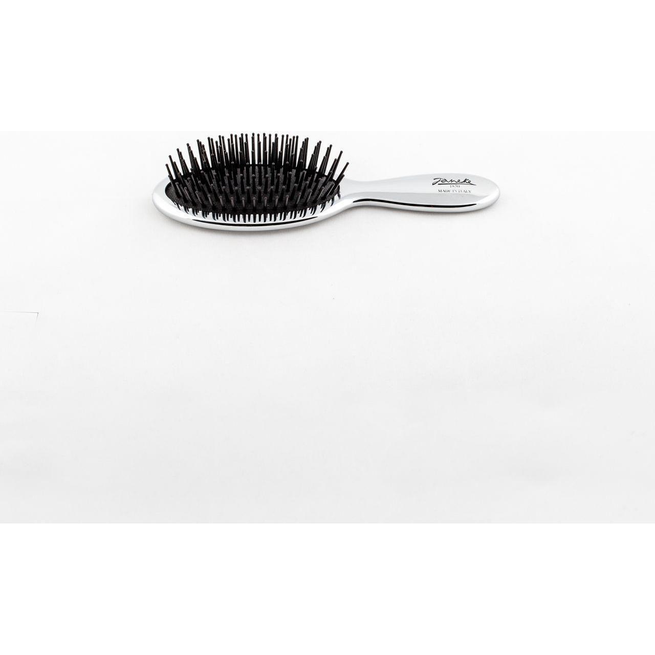 Janeke Silver Hair Brush in travel size, lightweight and compact, ideal for easy hair grooming on the go from Pasteur Pharmacy.