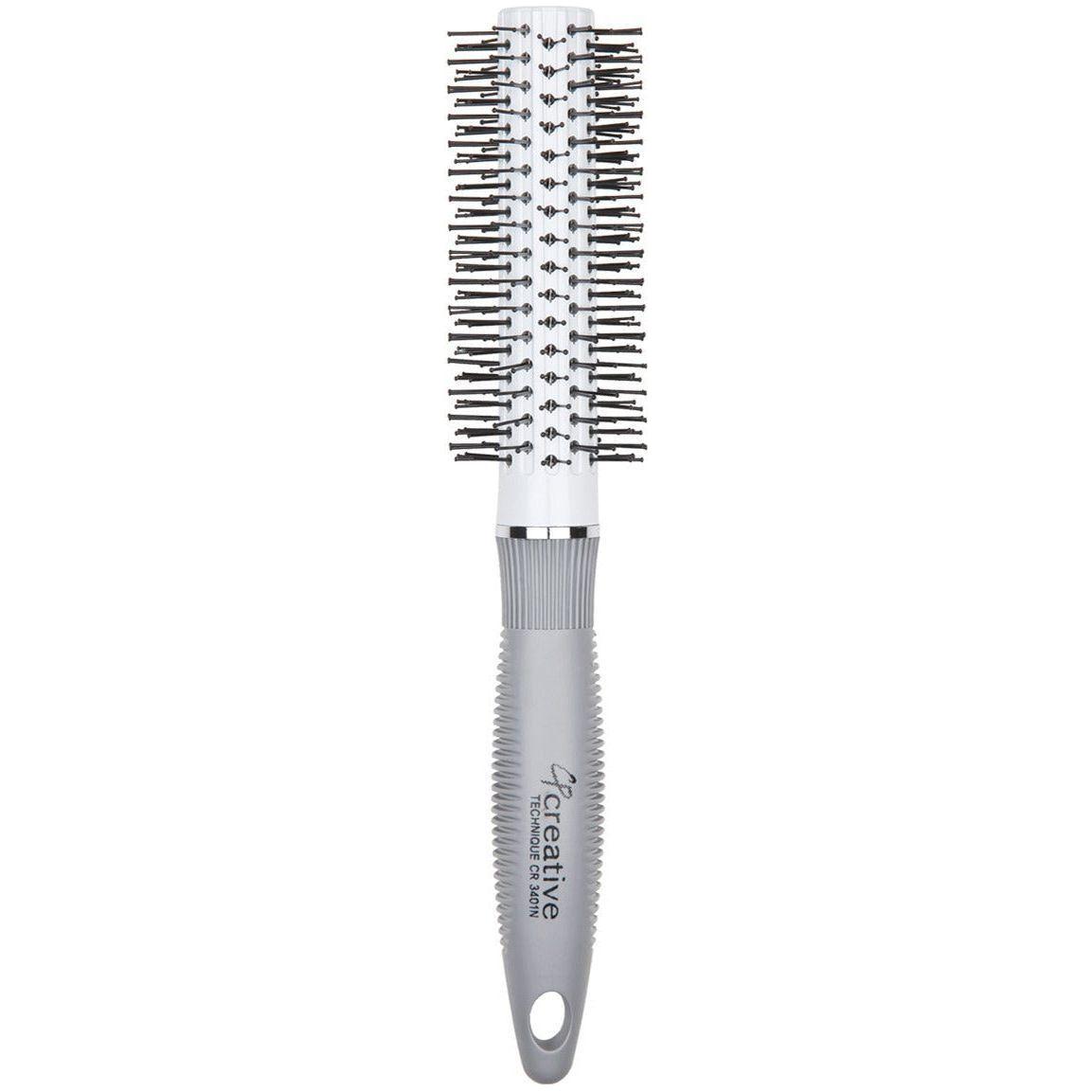Round styling hair brush with pin bristles by Pasteur Pharmacy, ideal for creating smooth, voluminous hairstyles.