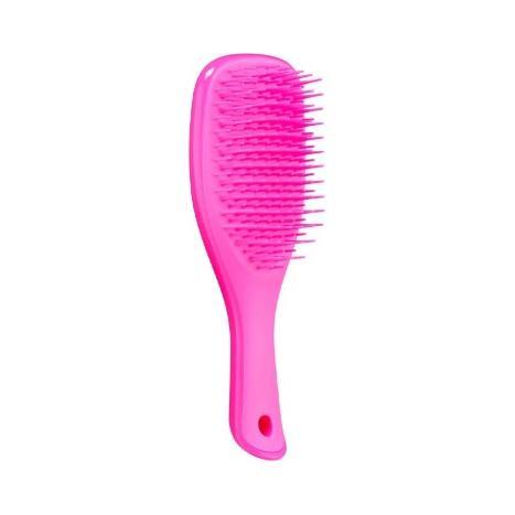 Hot pink Tangle Teezer mini hairbrush for detangling, featuring a compact design and ergonomic handle for easy styling.