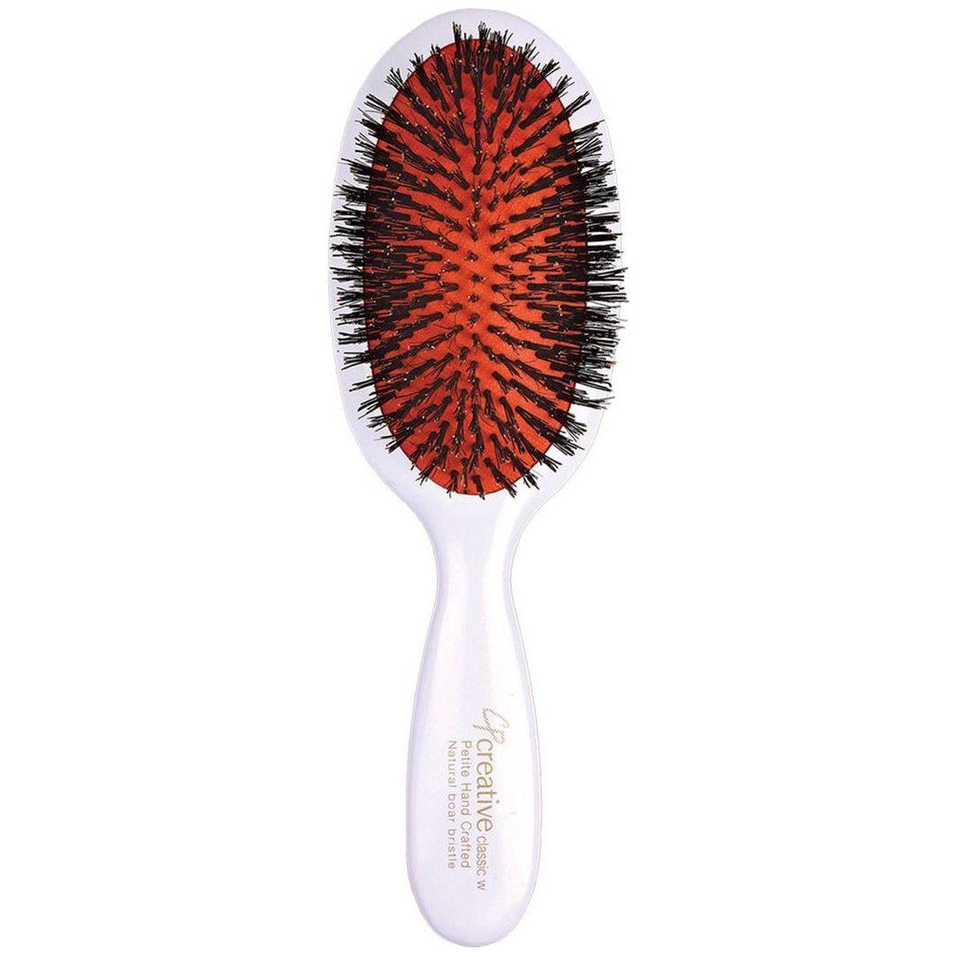 Classic white paddle hair brush with boar bristles from Pasteur Pharmacy, designed for gentle hair detangling and styling.