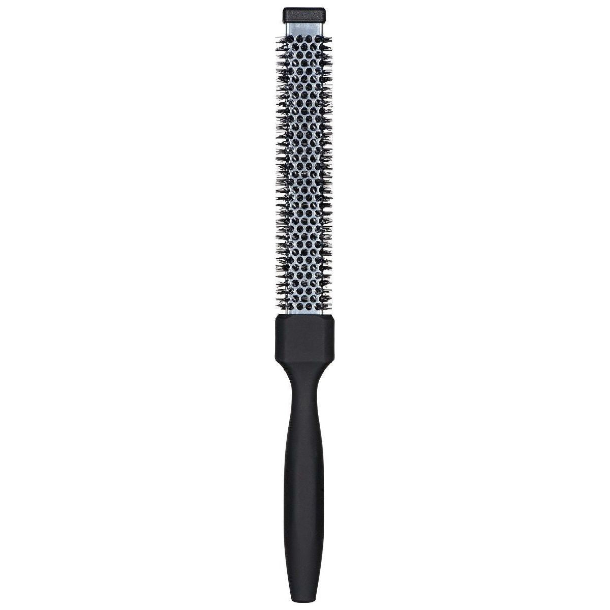 Small flat thermal hair brush by The Wollow, made in Italy, with bristles designed for smooth styling and heat distribution.