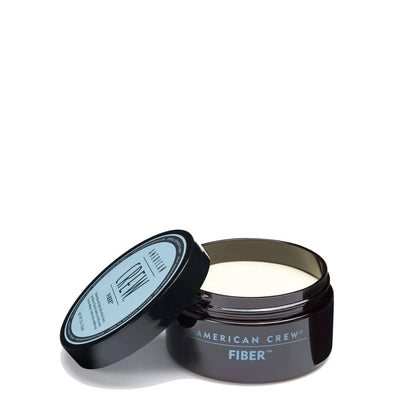 American Crew Hair Fiber 1.75 oz in a jar for thickening and texturizing hair, shown in a close-up image.