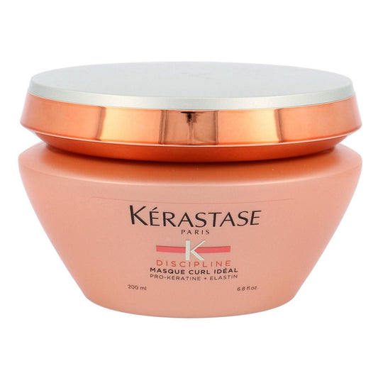 Kerastase Discipline Curl Ideal Hair Mask, a nourishing hair care treatment for curly hair, shown in a jar with product label visible.