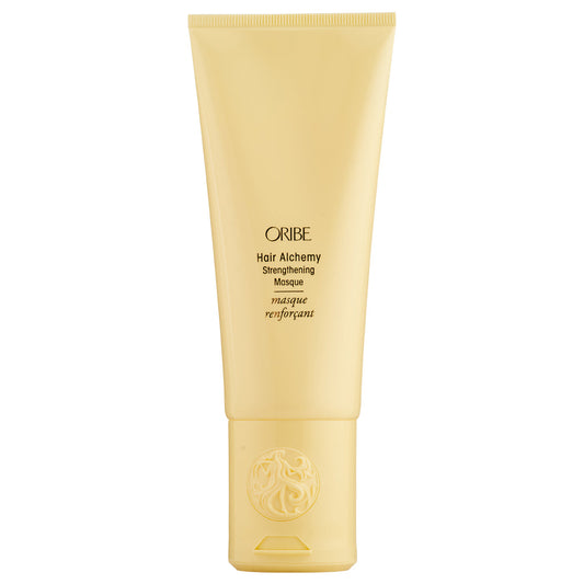 Oribe Hair Alchemy Strengthening Masque in a jar, designed to nourish and reinforce hair with a luxurious hair care treatment.