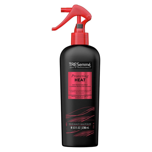 TRESemme Thermal Creations Heat Tamer Leave-In Spray in 8 Fl Oz bottle, for heat protection and hair care.