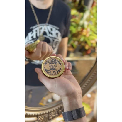 Death Grip Slayer Organic Hair Clay by Pasteur Pharmacy, medium hold, 2 oz jar showing the clay's texture and packaging.